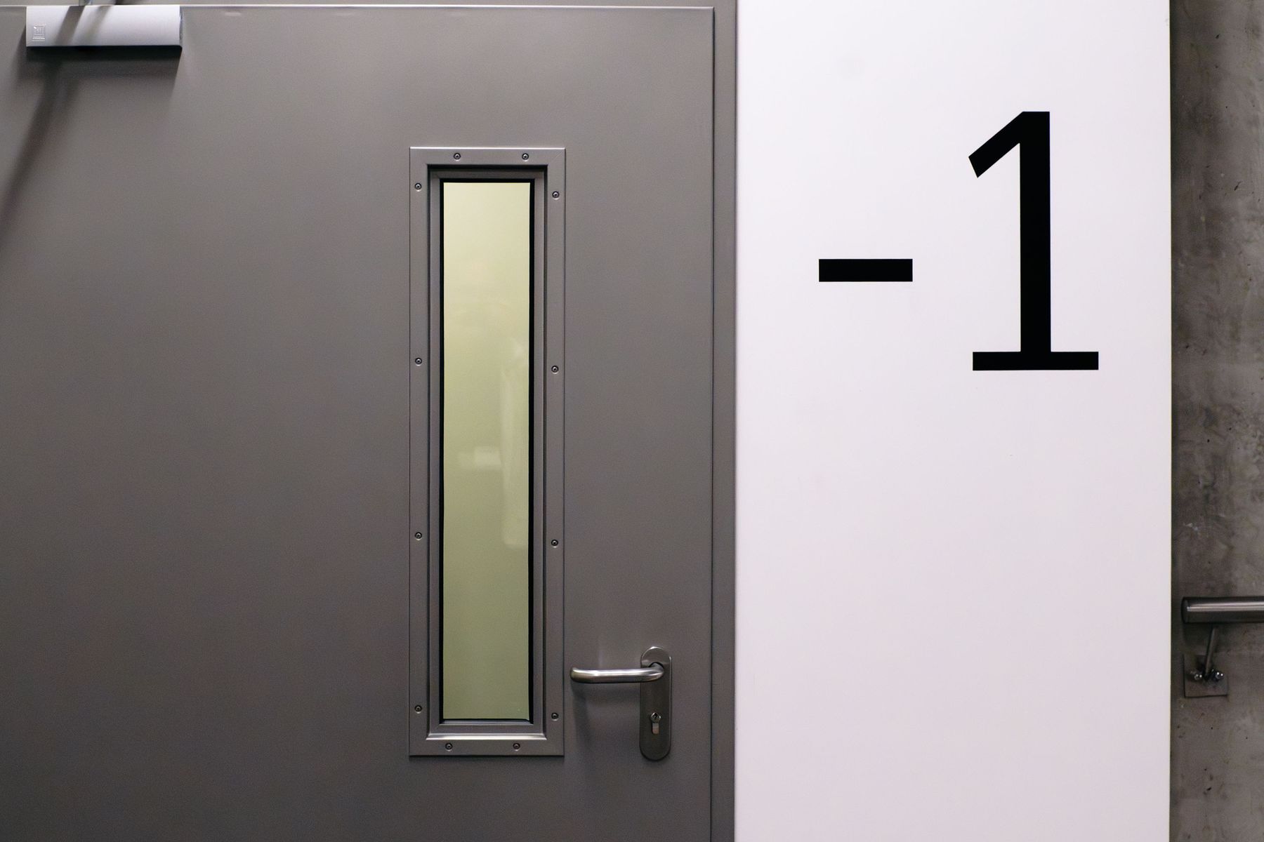 Steel fire-rated door with a reinforced viewing window